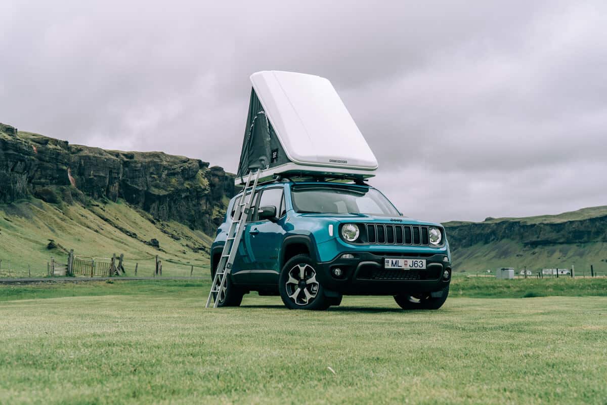 4x4 campervan with roof tent parked in the Icelandic highlands